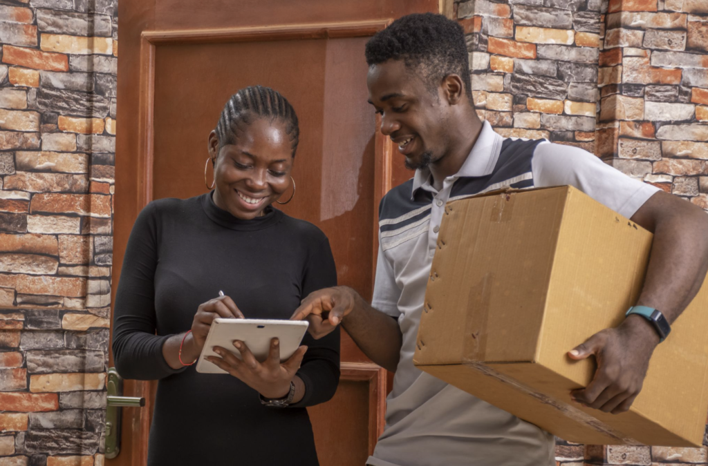 ePOD being signed on a tablet during a courier handover, supporting better delivery workflow management and fewer paper-based POD delays.